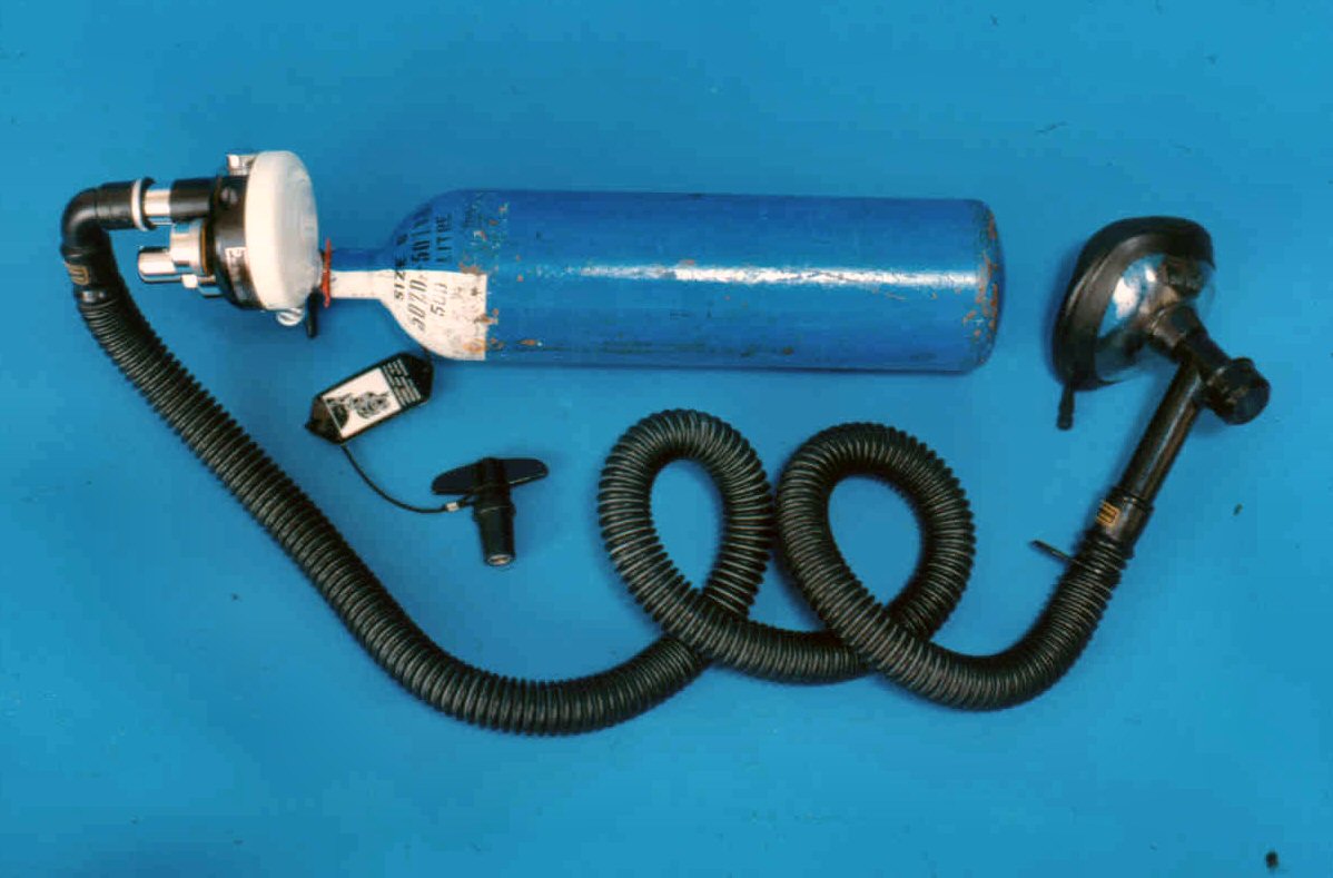 Compact and portable apparatus with Entonox, (premixed 50% nitrous oxide and 50% oxygen) cylinder. The mask is applied tightly to the face. A pressure gauge indicates the quantity of gas mixture in the cylinder.